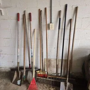 Assortment of hand tools- brooms, shovels, rakes, forks