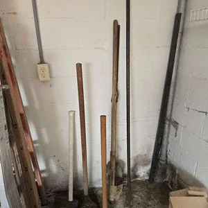 Spud bar, post hole digger, sledge hammer, axe, dirt tamper