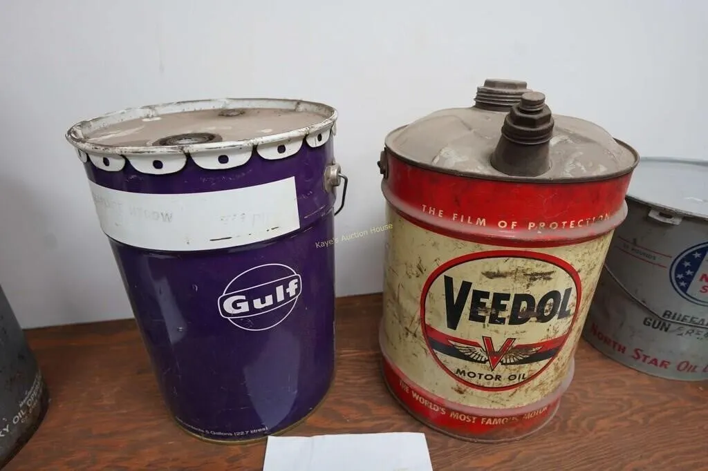 Gulf and Veedol motor oil cans