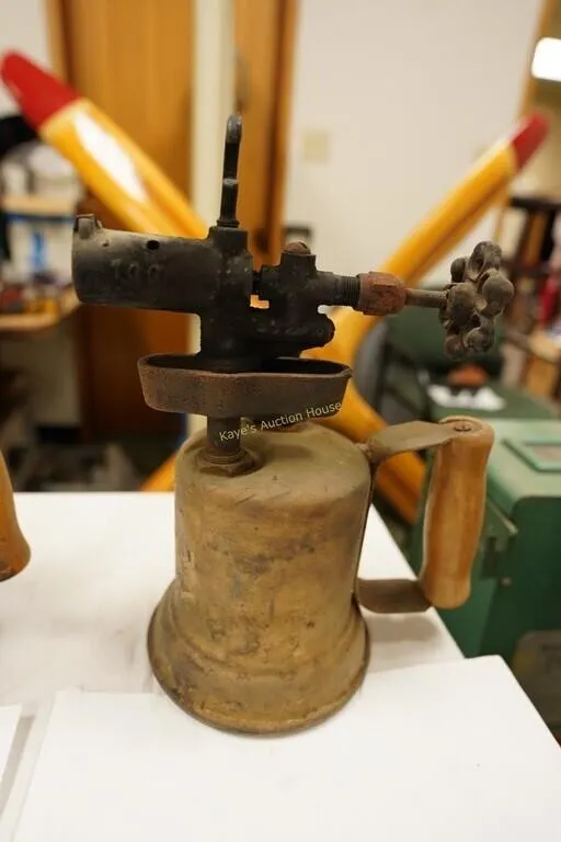antique blowtorch with wooden handle