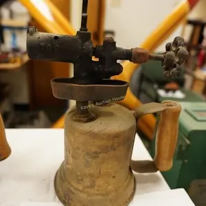 antique blowtorch with wooden handle