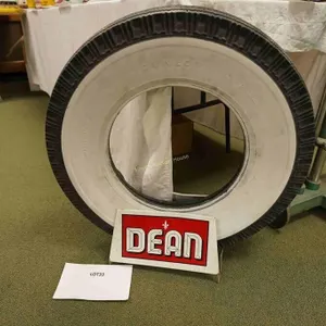 vintage Dunlop whitewall tire with Dean sign