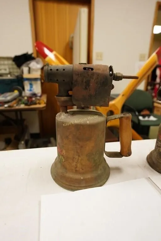 antique blowtorch with wooden handle