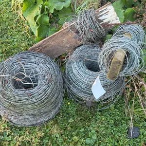 Three Rolls of Barbed Wire with Fence Posts