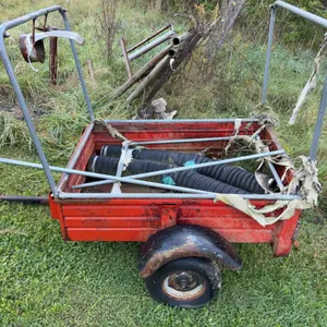 Red Utility Trailer With Framework and Hoses