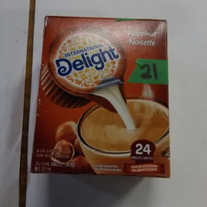 SHELF PULLS (AS IS):  24 SINGLE SERVE INTERNATIONAL DELIGHT HAZELNUT COFFEE WHITENER - BOX