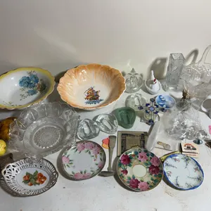 Flat of decorative glassware including (2) hen on a nests, glass basket, saucers & more