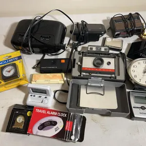 Polaroid 220 camera, pocket carefree 110 film camera & assortment of alarm clocks