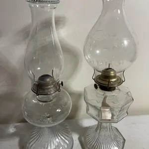 (2) clear glass oil lamps