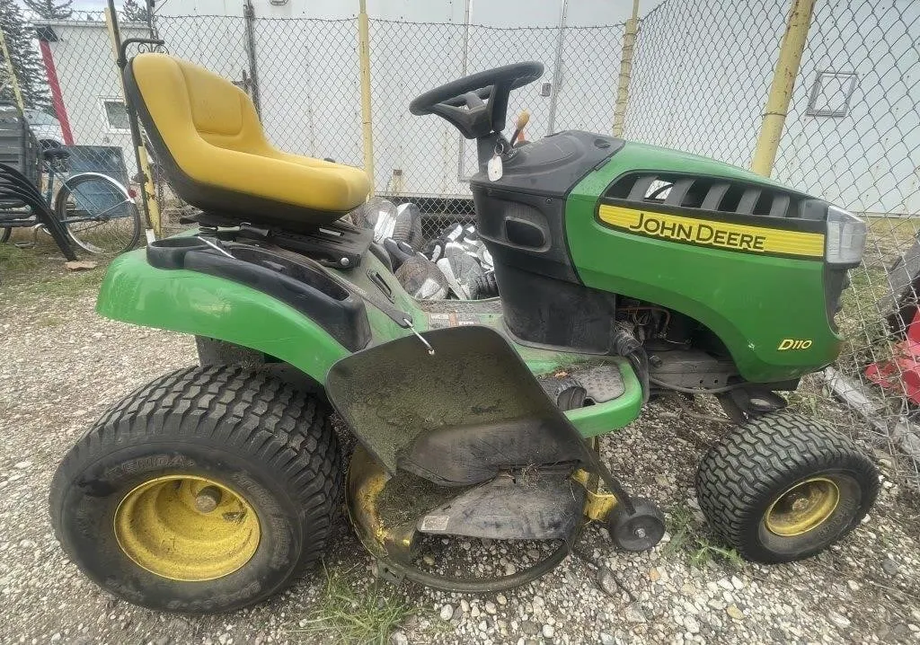 John Deere D110 riding lawn tractor with a