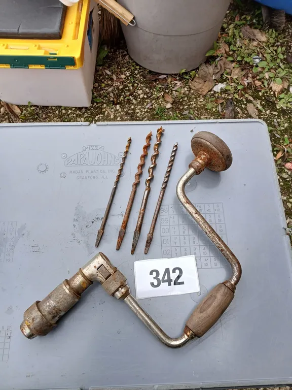 Vintage hand brace and auger bits