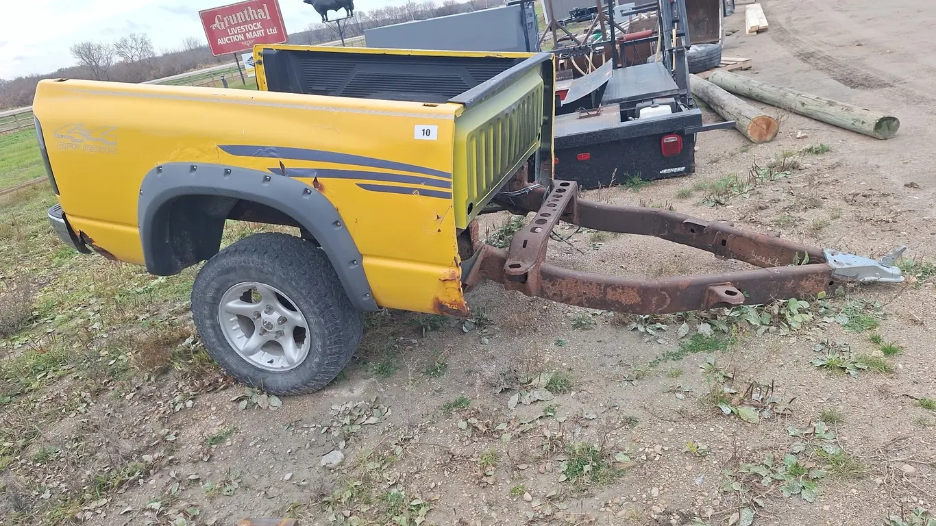 Yellow trailer from truck box
