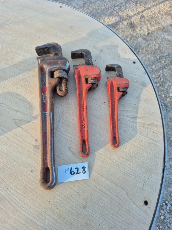 Three pipe wrenches