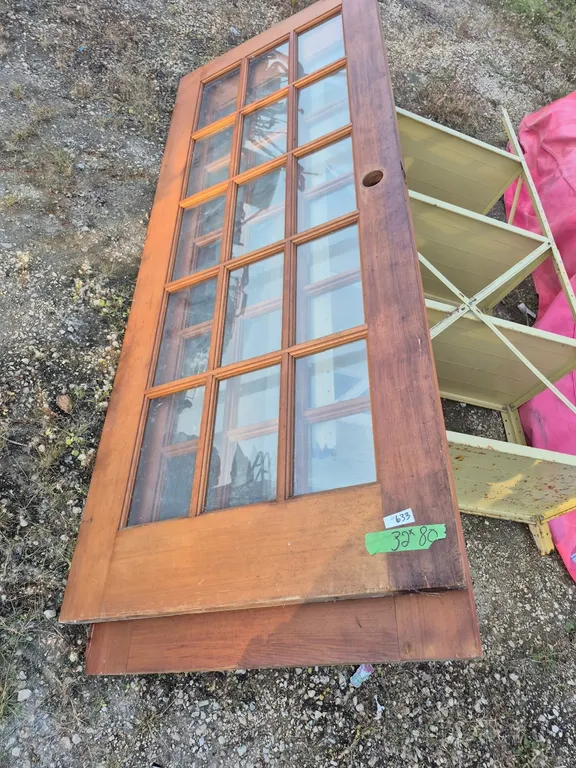 Two vintage doors with glass thirty two by eighty