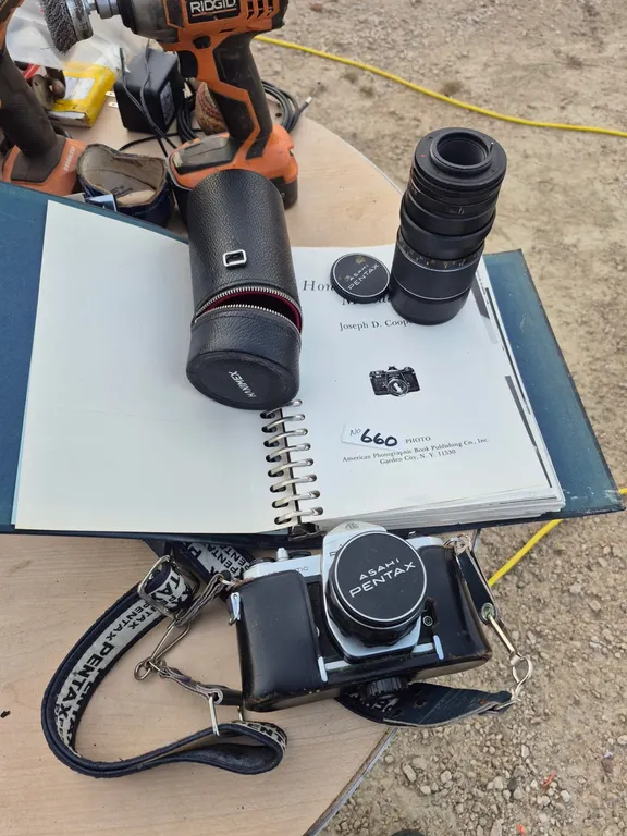 Pentex camera, zoom lens and vintage pentex instruction book.