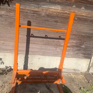 Orange Metal Cylinder Cart With Wheels And Upright Frame