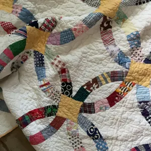 A handmade quilt double wedding ring and a blanket