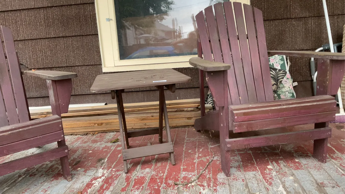 Two Adirondack chairs, and a table