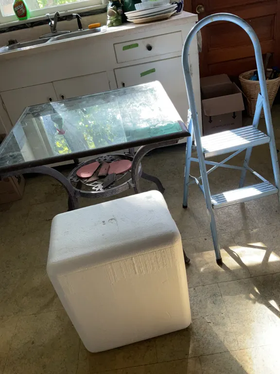 Glass top table, step stool, styrofoam cooler with ice packs