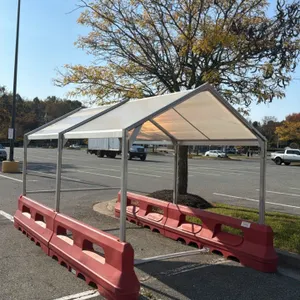 Metal frame shopping cart corrals. Features aluminum frame construction, translucent polycarbonate peaked roof, and red molded plastic base bumpers. 9