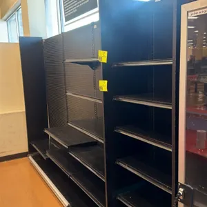 11'L of Lozier wall shelving. 84"H uprights with 16"D base shelves. Features pegboard backing and adjustable metal shelves. Note: Sold by the foot.