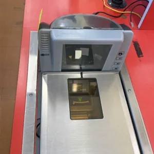 NCR 7878-2000 point-of-sale grocery scanners. Features integrated bi-optic scanning windows, stainless steel scale platters, and push-button controls.