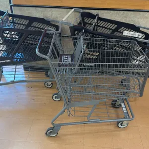 Assorted shopping carts. Includes plastic basket and metal wire styles. Features folding child seats, lower parcel shelves, and push handles. Mounted 
