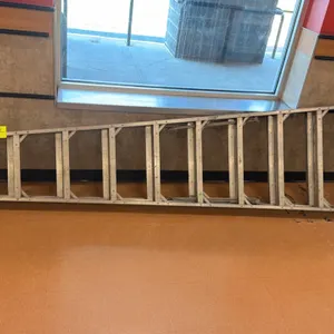 Werner aluminum folding ladder. Features a tapered frame design, flat steps, and internal folding spreader braces. 10'L.