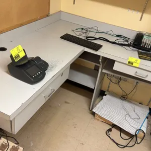 Laminate office countertops and wall-mounted shelving suite. Includes laminate countertops with integrated drawers, under-counter shelving, backsplash
