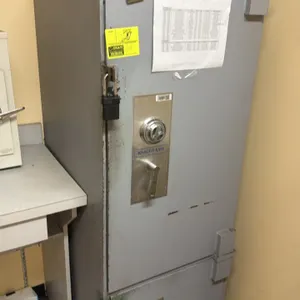 Knight Safe 2-door combination safe. Metal construction featuring dual compartments with mechanical combination dial locks and lever handles. Dimensio
