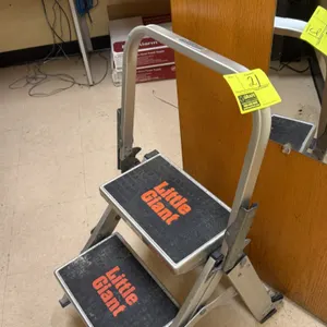 Little Giant folding 2-step stool. Features aluminum construction, an integrated safety handrail, and slip-resistant treaded steps.