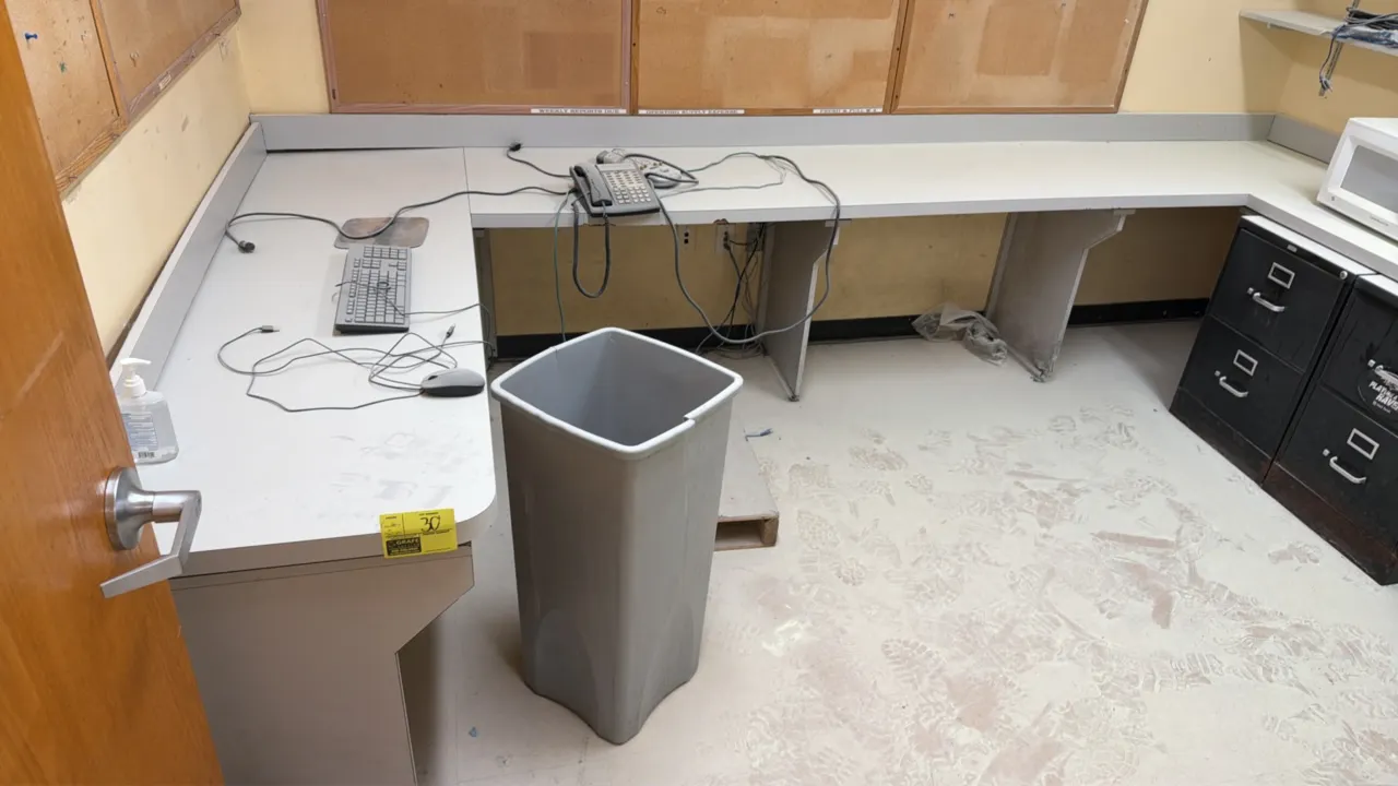 Laminate U-shaped countertop workstation with wall-mounted shelving. Features an integrated backsplash and a 3-tier adjustable wall shelving system wi