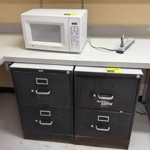 Metal 2-drawer filing cabinets. Features steel construction, metal pull handles, integrated label holders, and key lock cylinders. Note: Heavy rust al