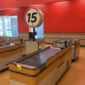 2008 Killion KCU1500 2-piece check lane counter. Features light-up lane 15 sign, 6' and 2' conveyor belts, cashier station, and bagging area. 14'L ove