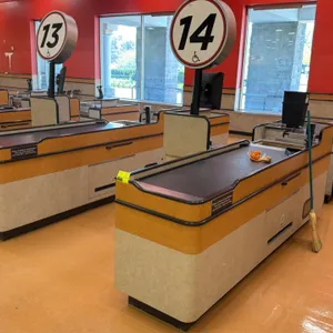2008 Killion KCU1500 2-piece check lane counters. Features 6' and 2' conveyor belts, illuminated numbered aisle signs, under-counter shelving, and bag