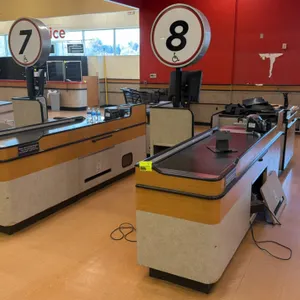 Killion KCU1500 2-piece check lane counters. Features 6' and 2' conveyor belts, lighted overhead lane number signs (#7 and #8), and lower storage comp