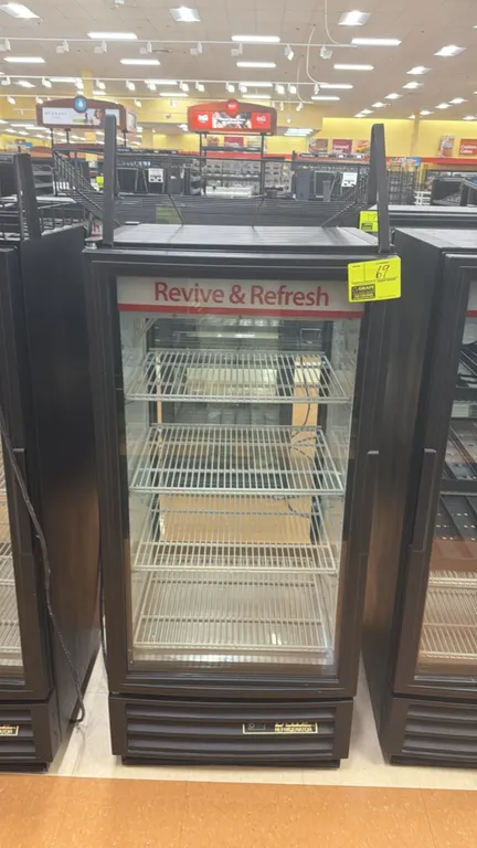 True GDM-10PT-HC-LD pass-through glass door beverage merchandiser. Features self-contained refrigeration, 2-door pass-through design, adjustable wire