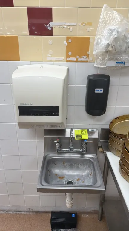 Stainless steel wall-mounted hand sink. Features splash-mount gooseneck faucet with dual lever handles. Includes Kimberly-Clark paper towel dispenser