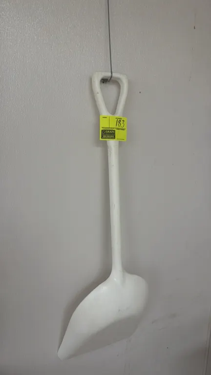 Poly ice shovel. Features one-piece molded plastic construction with a D-grip handle.