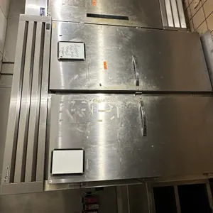 True Commercial floor level freezer with rolling carts