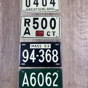 Four 1953 Miniature Toy Bicycle Plates