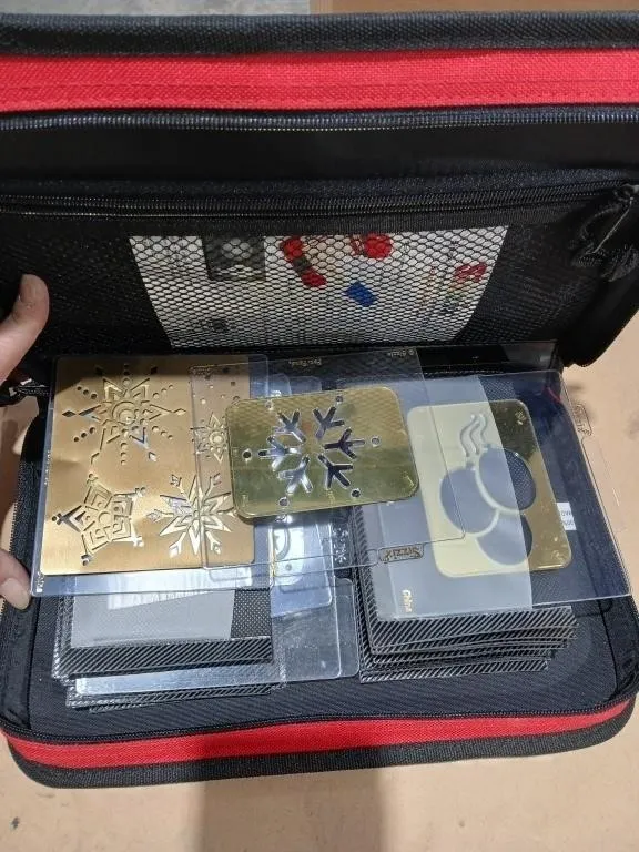 Cloth binder w/ assorted Brass embossing templates