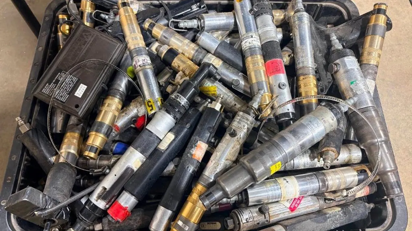Bin of Multiple Industrial Pneumatic Tools