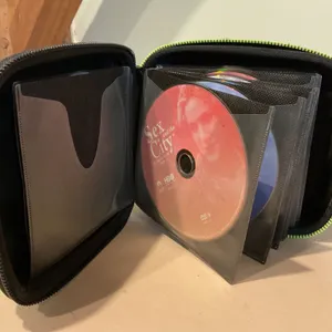 Portable CD Case With DVDs and TV Series Discs