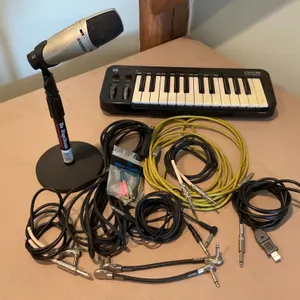 Music Equipment Including Microphone, Cables, Keyboard, and Case