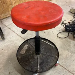 Adjustable Mechanic’s Rolling Seat With Red Cushion and Casters