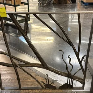 Decorative metal gate. Features a rustic nature motif with textured branch, grass, and stone accents, integrated latch tab, and hinge mounts. 39"W x 3
