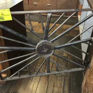 Decorative metal gates. Includes (1) gate with radial spoke pattern and center medallion and (1) gate with flying waterfowl and cattail design. Featur