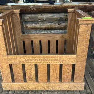 Wood portable merchandiser display bin. Features slatted wood panel construction, drop-front design, textured wood trim accents, and a solid interior 
