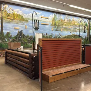 Rustic double checkout lane. Features log-style exterior construction, metal-banded countertops, under-counter shelving and cabinets, slatwall display